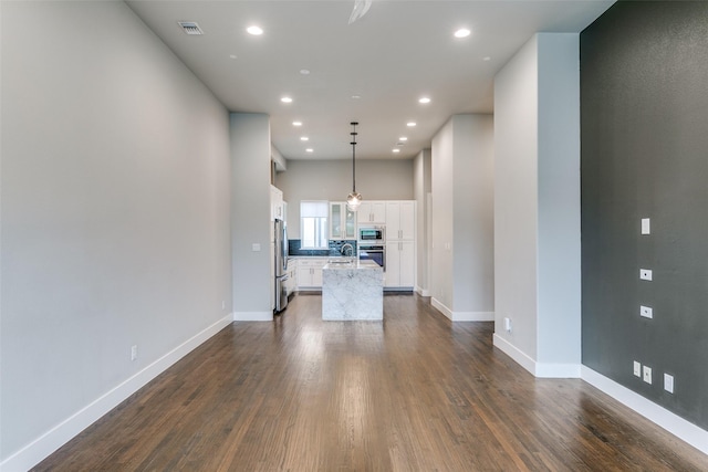 3816 Roseland Ave Unit C200, Dallas, TX 75204 - unfurnished living room featuring dark wood-type flooring and recessed lighting