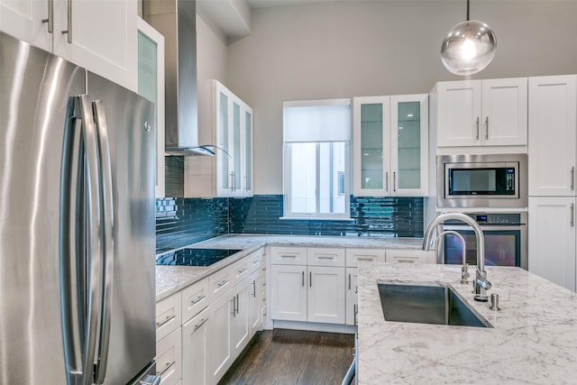 3816 Roseland Ave Unit C200, Dallas, TX 75204 - kitchen with appliances with stainless steel finishes, wall chimney exhaust hood, white cabinets, glass insert cabinets, and backsplash