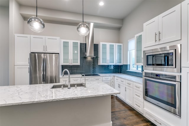 3816 Roseland Ave Unit C200, Dallas, TX 75204 - kitchen with appliances with stainless steel finishes, wall chimney exhaust hood, pendant lighting, glass insert cabinets, and light stone counters