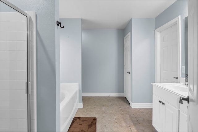 229 Maggie Cir, Flint, TX 75762 - bathroom with vanity, a bath, tile patterned flooring, tiled shower, and baseboards