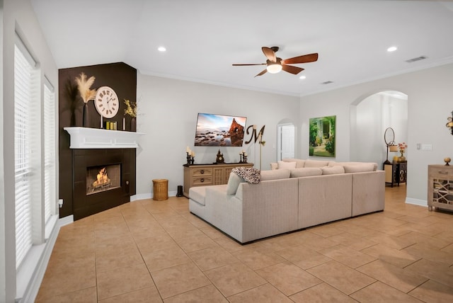 229 Maggie Cir, Flint, TX 75762 - living area with arched walkways, a ceiling fan, light tile patterned floors, recessed lighting, and a tiled fireplace