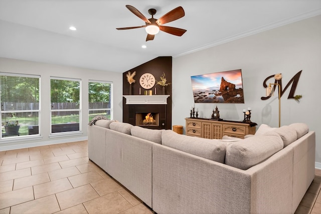 229 Maggie Cir, Flint, TX 75762 - living room with ceiling fan, a warm lit fireplace, light tile patterned flooring, recessed lighting, and crown molding