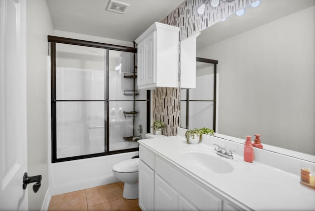 229 Maggie Cir, Flint, TX 75762 - bathroom featuring toilet, vanity, bath / shower combo with glass door, and tile patterned floors