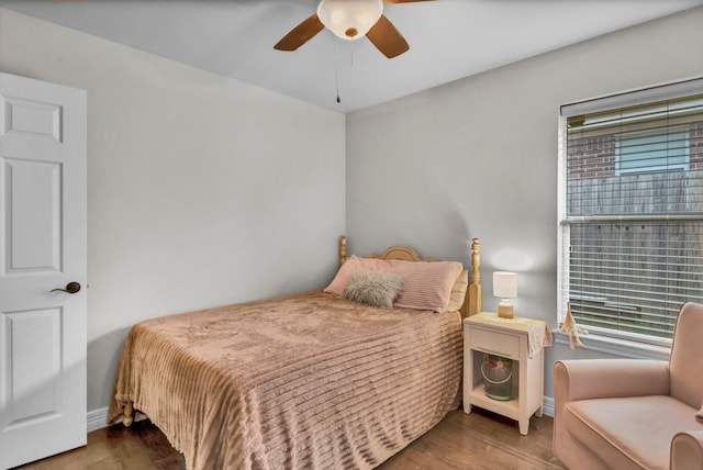 229 Maggie Cir, Flint, TX 75762 - bedroom featuring multiple windows, wood finished floors, baseboards, and ceiling fan