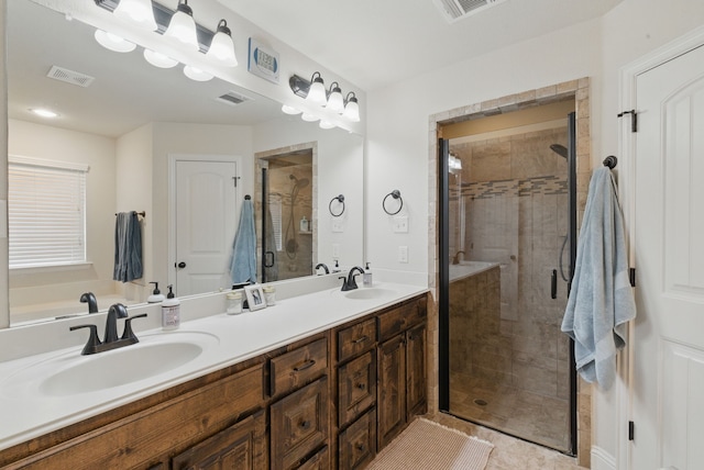 616 Zachary Dr, Weatherford, TX 76087 - bathroom featuring a shower stall, double vanity, and tile patterned floors