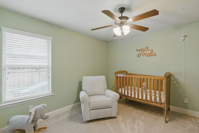 616 Zachary Dr, Weatherford, TX 76087 - carpeted bedroom featuring a crib, baseboards, and a ceiling fan