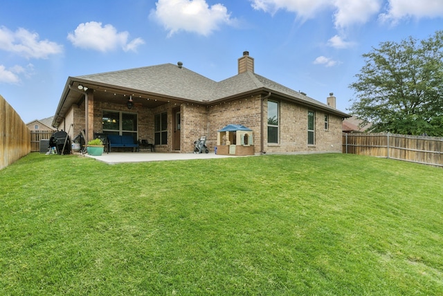 616 Zachary Dr, Weatherford, TX 76087 - back of property with a chimney, brick siding, a ceiling fan, and a patio area