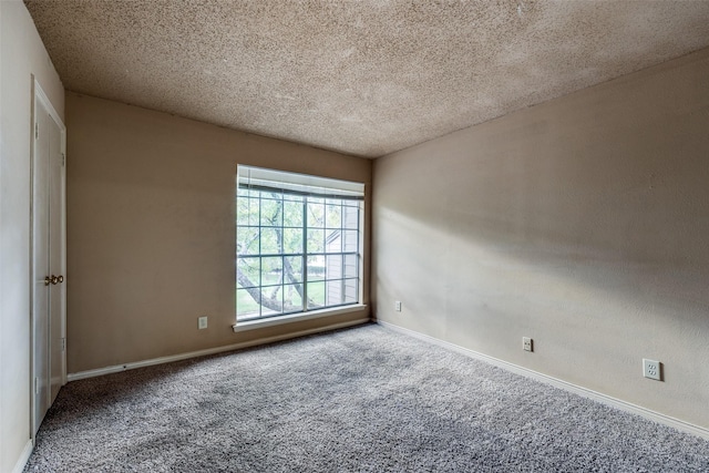 9801 Royal Ln Unit 703, Dallas, TX 75231 - carpeted empty room with baseboards and a textured ceiling