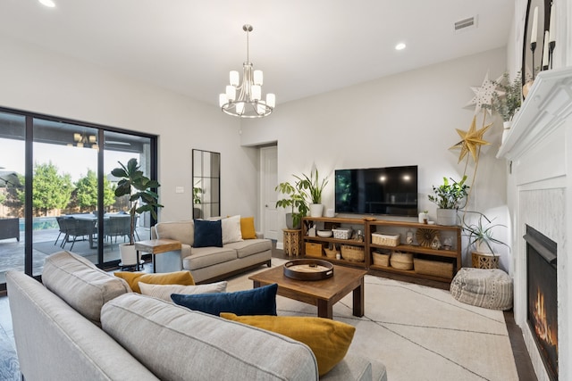 925 Glen Lake Dr, Southlake, TX 76092 - living room with a warm lit fireplace, a chandelier, and recessed lighting