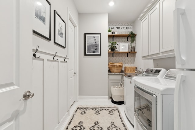 925 Glen Lake Dr, Southlake, TX 76092 - washroom with cabinet space, washing machine and clothes dryer, and recessed lighting