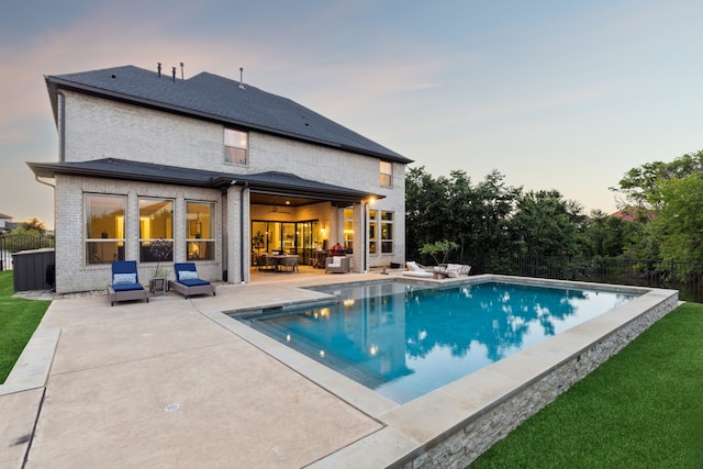 925 Glen Lake Dr, Southlake, TX 76092 - back of house at dusk featuring a patio and outdoor lounge area
