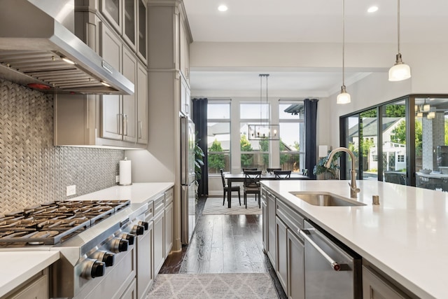 925 Glen Lake Dr, Southlake, TX 76092 - kitchen with stainless steel appliances, wall chimney exhaust hood, gray cabinetry, light countertops, and recessed lighting
