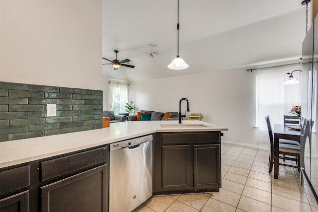 2012 Falls Creek Dr, Little Elm, TX 75068 - kitchen with stainless steel dishwasher, a sink, a ceiling fan, dark brown cabinets, and light countertops