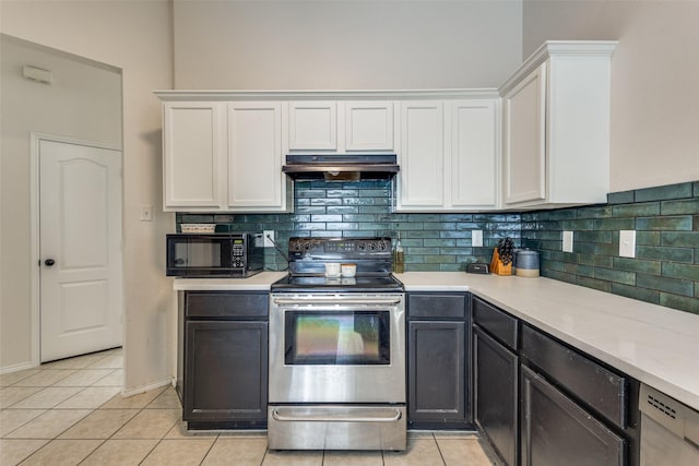 2012 Falls Creek Dr, Little Elm, TX 75068 - kitchen with stainless steel electric stove, under cabinet range hood, black microwave, and white cabinets