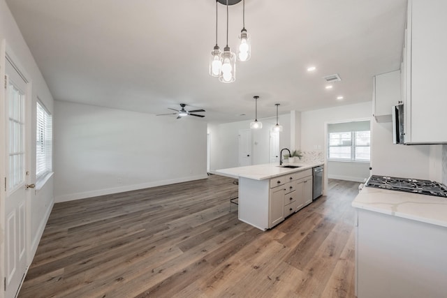 509 Twilight Dr, Garland, TX 75040 - kitchen with a sink, dishwasher, a ceiling fan, white cabinetry, and open floor plan