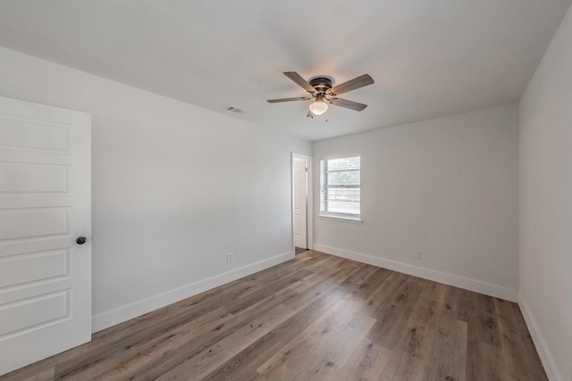 509 Twilight Dr, Garland, TX 75040 - unfurnished room with ceiling fan, baseboards, and wood finished floors