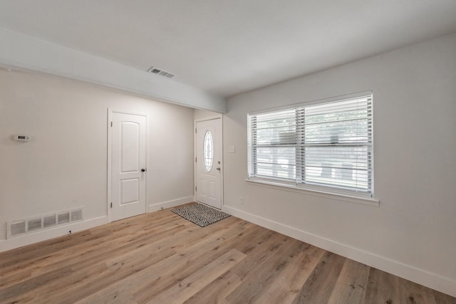 509 Twilight Dr, Garland, TX 75040 - foyer featuring baseboards and light wood-style floors