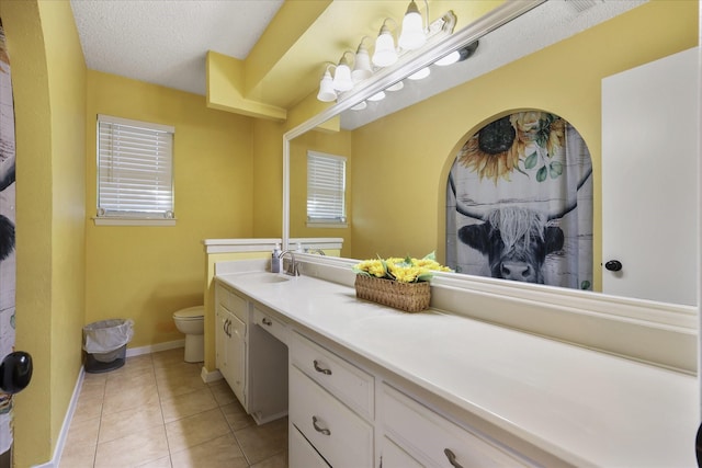 4225 Toledo Ave, Fort Worth, TX 76133 - full bath featuring tile patterned flooring, toilet, double vanity, baseboards, and a textured ceiling