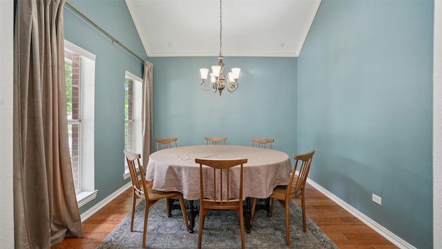 1607 Woodstream Ln, Allen, TX 75002 - dining space featuring crown molding, wood finished floors, a chandelier, and baseboards