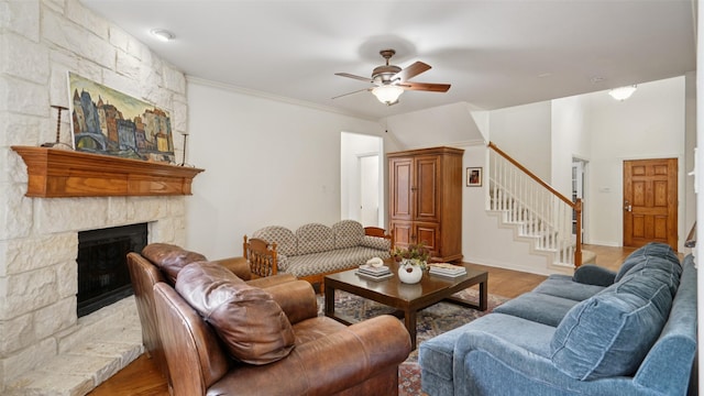 1607 Woodstream Ln, Allen, TX 75002 - living area featuring a ceiling fan, stairs, a stone fireplace, wood finished floors, and baseboards