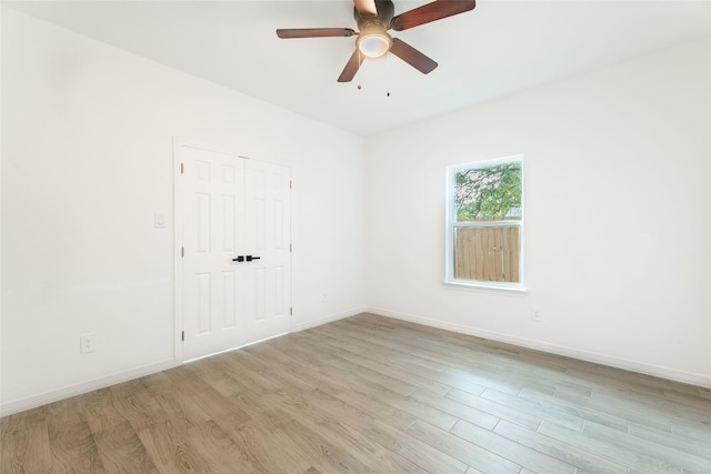 4709 Lee St, Greenville, TX 75401 - spare room featuring light wood finished floors, baseboards, and ceiling fan