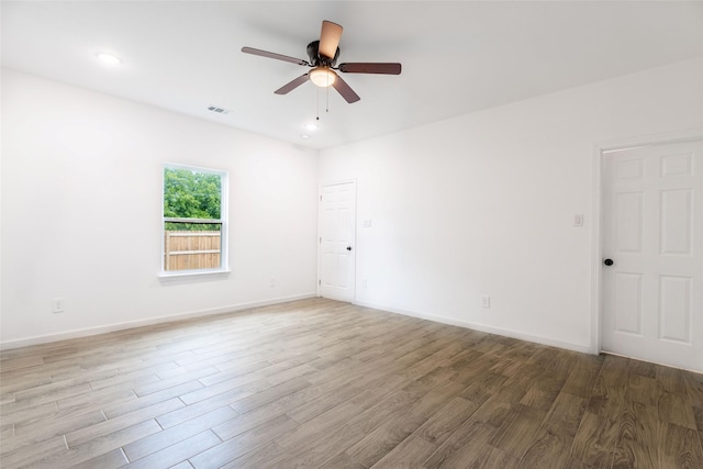 4709 Lee St, Greenville, TX 75401 - spare room with wood finished floors, a ceiling fan, baseboards, and recessed lighting