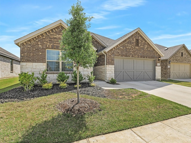 2624 Rambling Rd, Celina, TX 75009 - view of front of house featuring a garage, brick siding, driveway, a front lawn, and stone siding