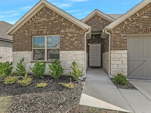 2624 Rambling Rd, Celina, TX 75009 - entrance to property featuring brick siding, a garage, stone siding, and roof with shingles