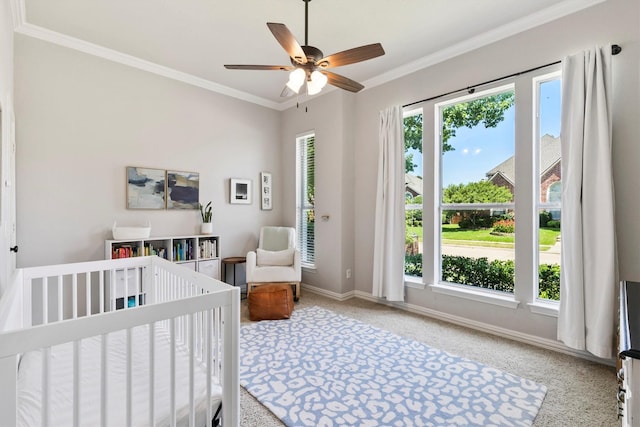 4548 Pecan Valley Dr, Plano, TX 75093 - bedroom featuring carpet floors, crown molding, baseboards, a crib, and ceiling fan