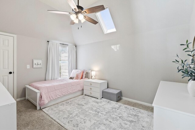 4548 Pecan Valley Dr, Plano, TX 75093 - bedroom featuring a skylight, light colored carpet, vaulted ceiling, baseboards, and ceiling fan
