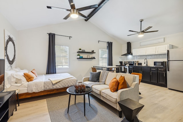 2435 W 10th St, Dallas, TX 75211 - bedroom featuring freestanding refrigerator, a sink, light wood-style floors, and ceiling fan