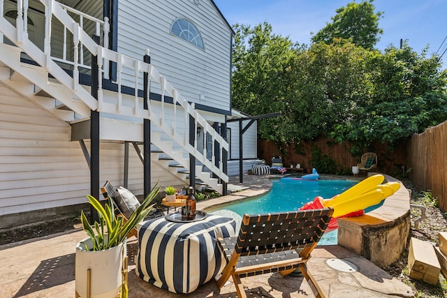 2435 W 10th St, Dallas, TX 75211 - fenced backyard featuring stairway and a patio area