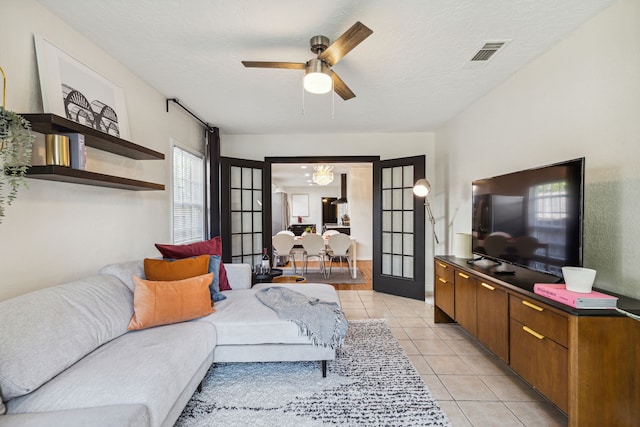 2435 W 10th St, Dallas, TX 75211 - living room featuring ceiling fan and light tile patterned floors