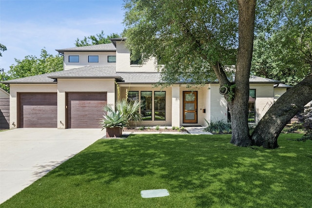 661 Harter Rd, Dallas, TX 75218 - view of front facade with a garage, driveway, a front lawn, and roof with shingles