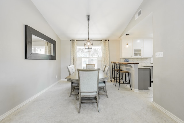 806 Twin View St, Heath, TX 75032 - dining space with lofted ceiling, light colored carpet, and baseboards