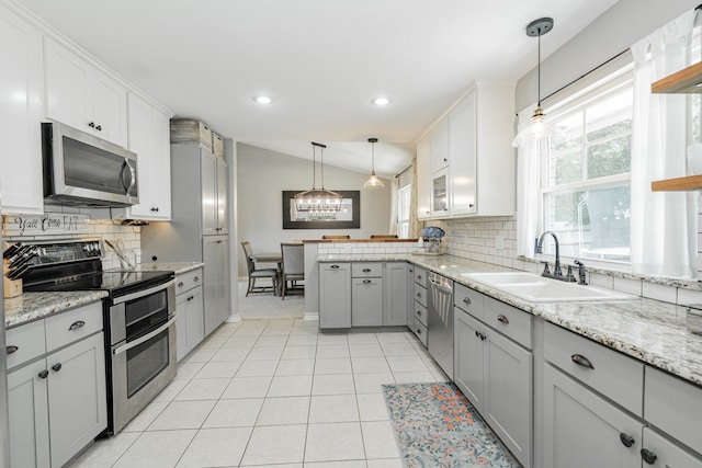 806 Twin View St, Heath, TX 75032 - kitchen featuring stainless steel appliances, a sink, a peninsula, decorative backsplash, and recessed lighting