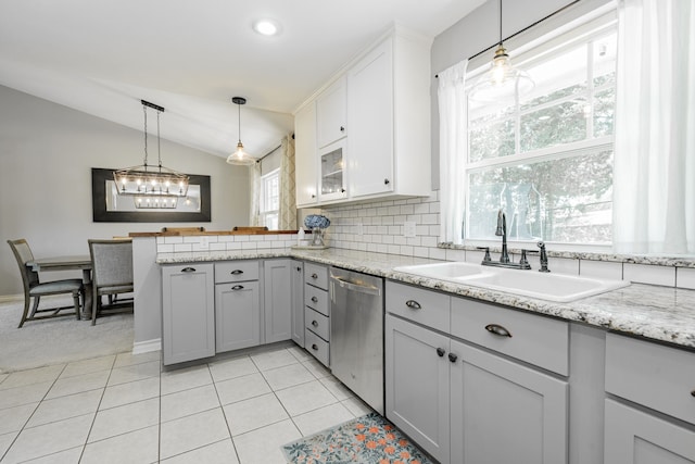 806 Twin View St, Heath, TX 75032 - kitchen with dishwasher, a sink, a peninsula, lofted ceiling, and pendant lighting