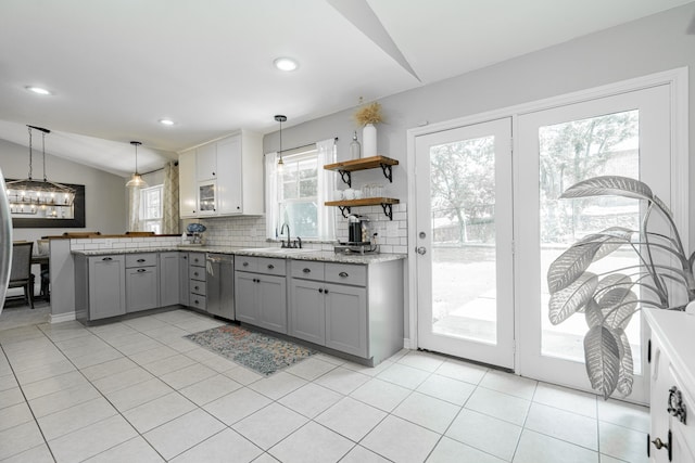 806 Twin View St, Heath, TX 75032 - kitchen featuring gray cabinets, stainless steel dishwasher, lofted ceiling, a peninsula, and healthy amount of natural light