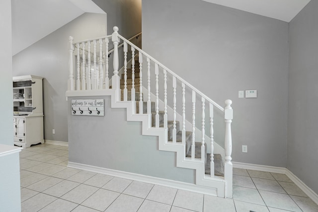 806 Twin View St, Heath, TX 75032 - staircase with vaulted ceiling, tile patterned floors, and baseboards