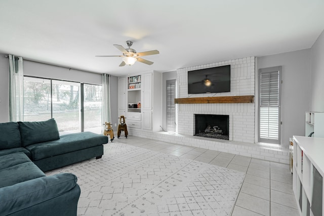 806 Twin View St, Heath, TX 75032 - living room with a ceiling fan, light tile patterned floors, a fireplace, and built in shelves