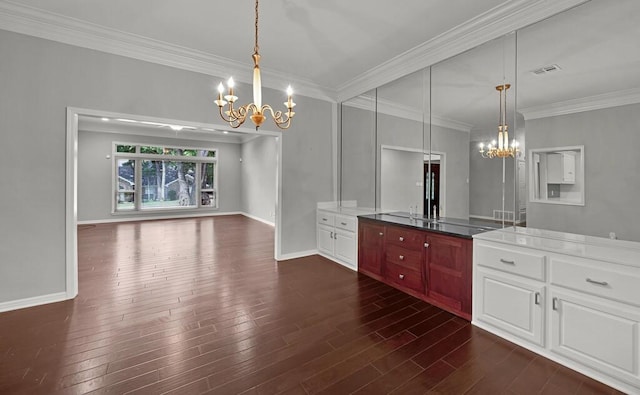 3009 Chimney Hill Dr, Waco, TX 76708 - unfurnished dining area featuring a chandelier, crown molding, dark wood-type flooring, and baseboards