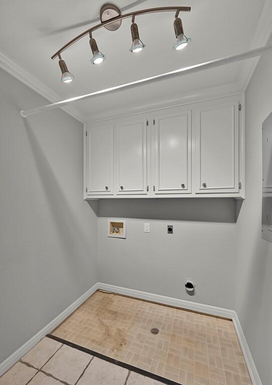 3009 Chimney Hill Dr, Waco, TX 76708 - washroom featuring cabinet space, hookup for an electric dryer, washer hookup, and baseboards
