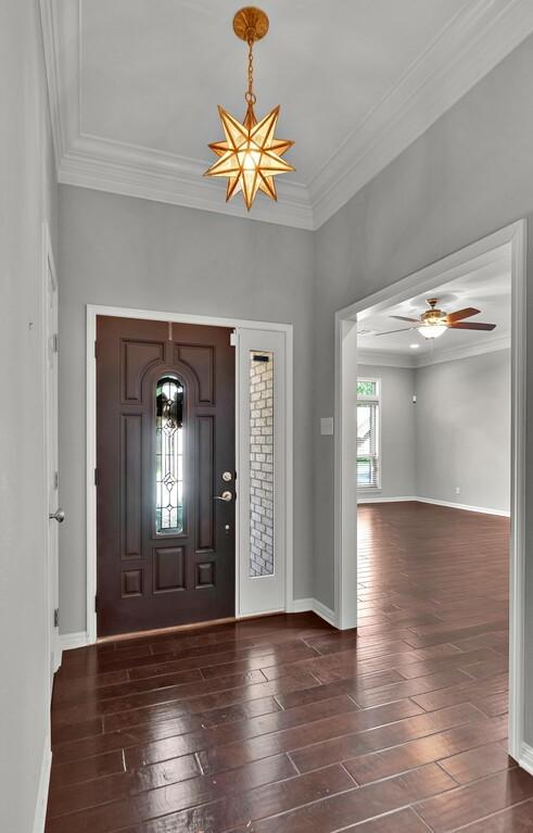 3009 Chimney Hill Dr, Waco, TX 76708 - foyer entrance with wood-type flooring, ornamental molding, a ceiling fan, and baseboards