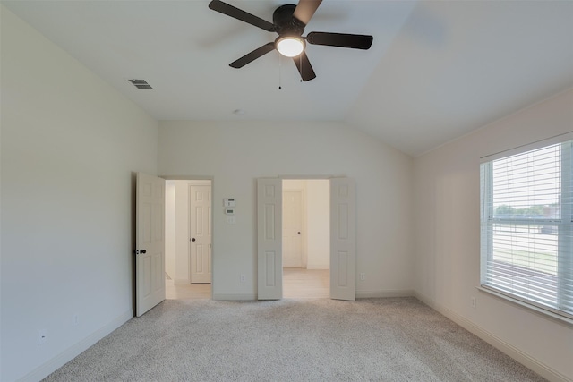 3037 Elmbrook Dr, Grand Prairie, TX 75052 - unfurnished bedroom featuring light colored carpet, baseboards, vaulted ceiling, and a ceiling fan