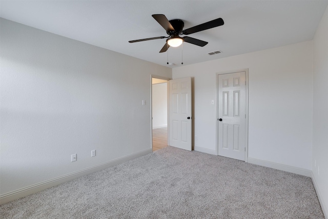 3037 Elmbrook Dr, Grand Prairie, TX 75052 - unfurnished bedroom with light colored carpet, baseboards, and a ceiling fan