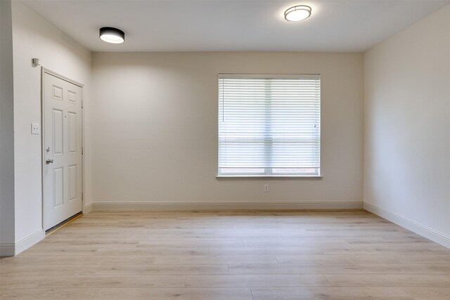 3037 Elmbrook Dr, Grand Prairie, TX 75052 - unfurnished room featuring light wood-style floors and baseboards