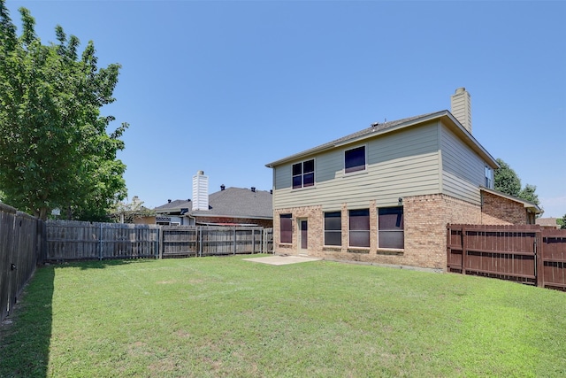 3037 Elmbrook Dr, Grand Prairie, TX 75052 - back of house with brick siding, a chimney, and a patio