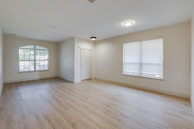 3037 Elmbrook Dr, Grand Prairie, TX 75052 - spare room with light wood-style floors and baseboards
