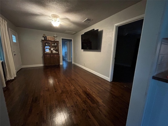 741 County Road 4681, Boyd, TX 76023 - unfurnished dining area featuring wood finished floors, baseboards, and a textured ceiling