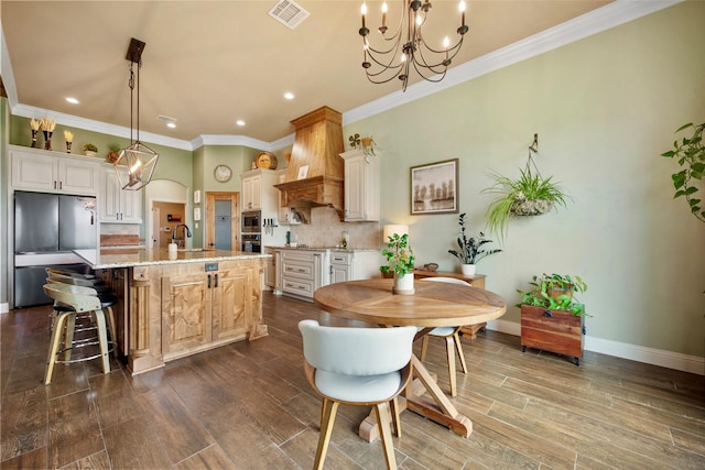134 Southern Ct, Springtown, TX 76082 - kitchen with a chandelier, premium range hood, tasteful backsplash, appliances with stainless steel finishes, and crown molding